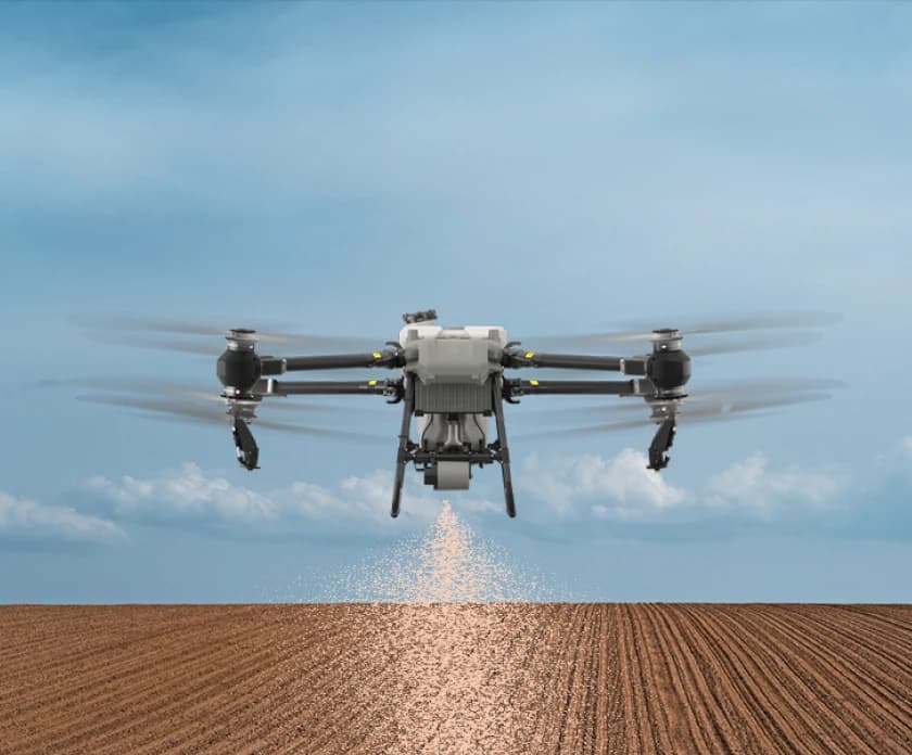 Drone seeding a field